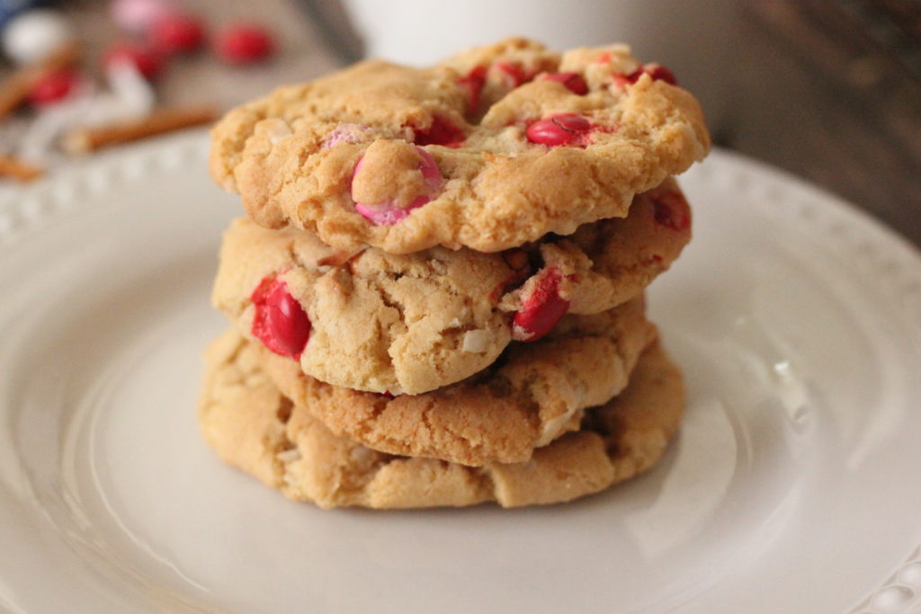 Coconut Chocolate Crunch Cookies image of 4 cookies baked golden brown with m & m's