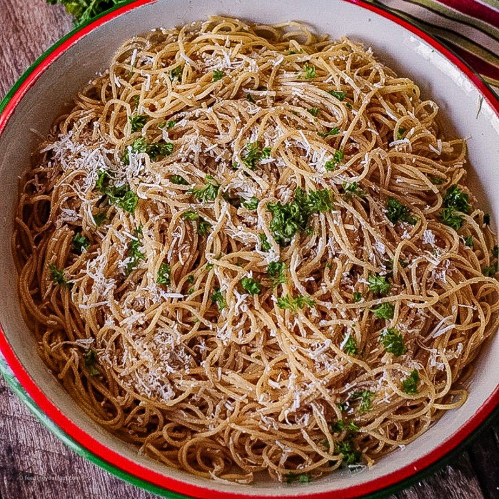 spaghetti pasta in a sauce made with brown butter annd mizithra cheese