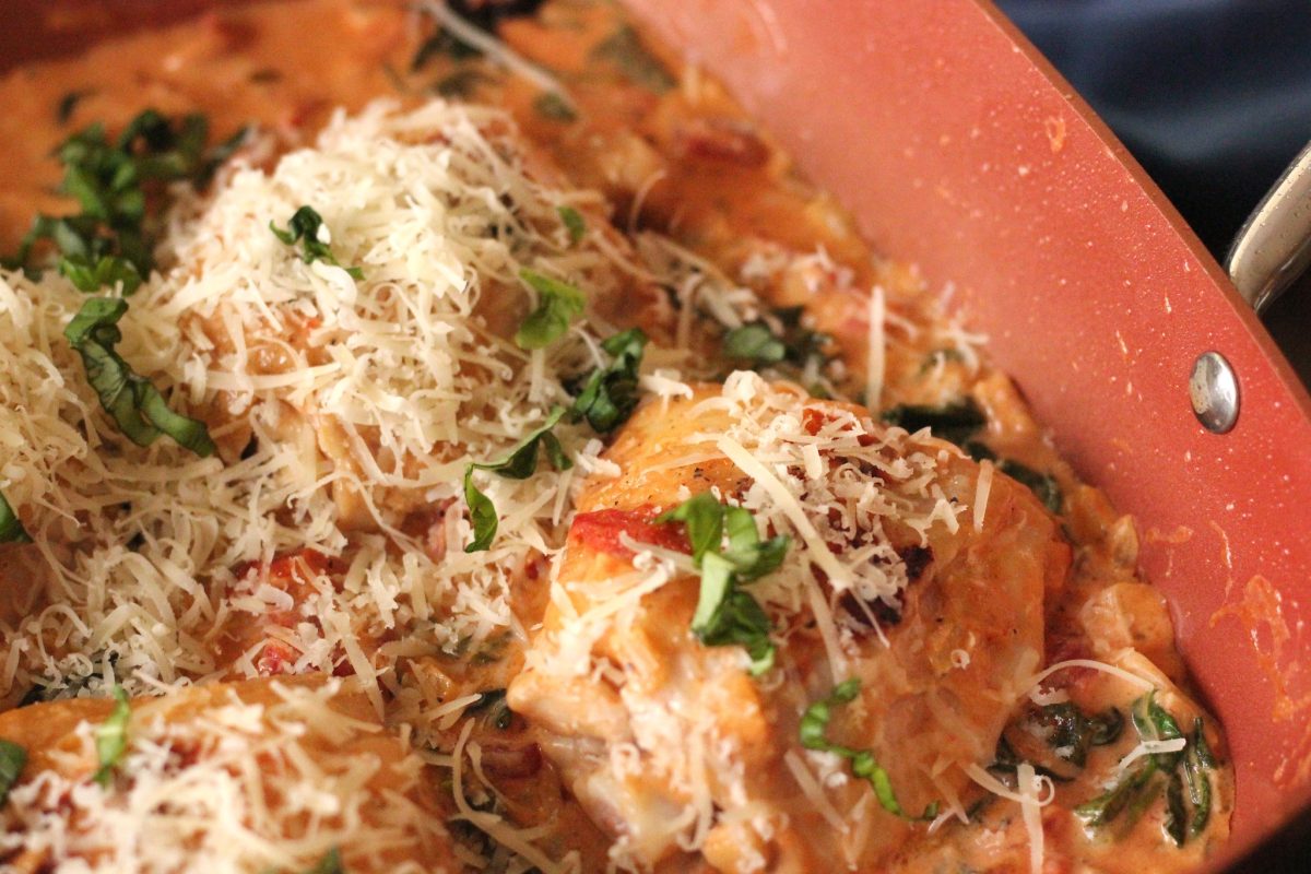 Creamy chicken and spinach topped with parmesan and basil