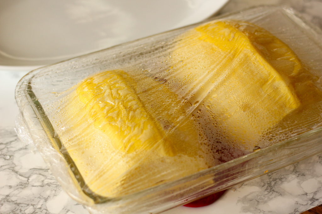 microwaved spaghetti squash in a glass baking dish