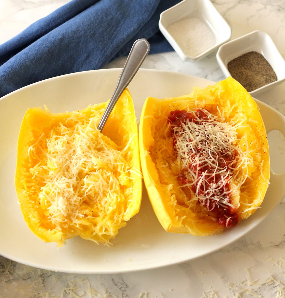 Spaghetti squash cooked in the microwave with marinara sauce and parmesan