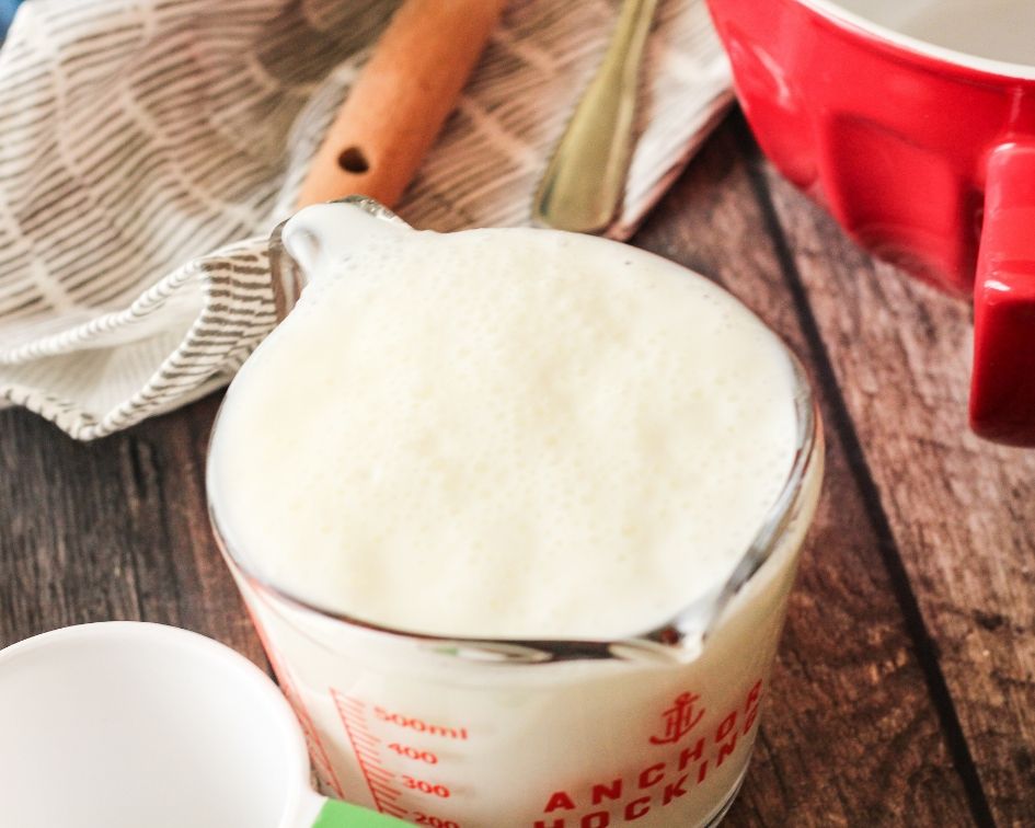 bubbly buttermilk in a measuring cup
