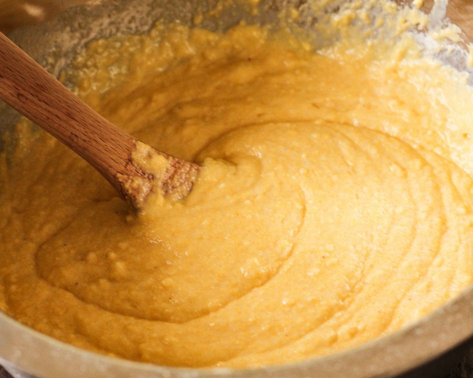 batter for cornbread in a silver bowl