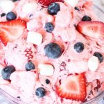 jello salad with strawberries, blueberries and marshmallows