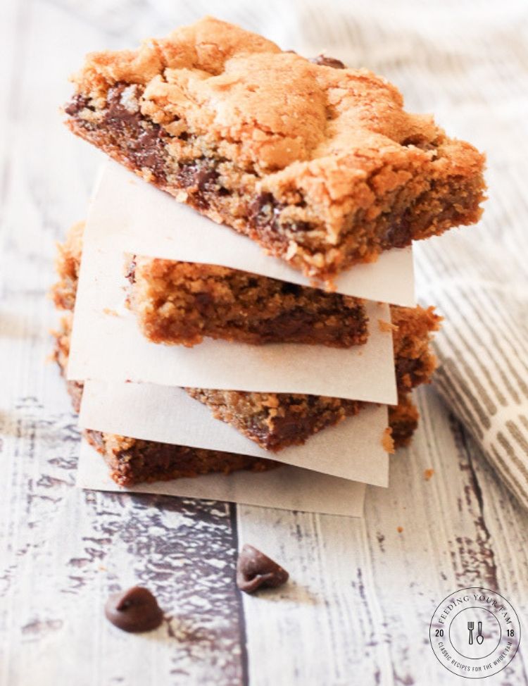 These Thick and Chewy Chocolate Chip Cookie Bars are rich, buttery and delicious!! Perfect for slicing and sharing, eating with a scoop of ice cream or packing for lunch! #chocolatechipcookies #cookiebars #chocolatechips stack of cookie bars