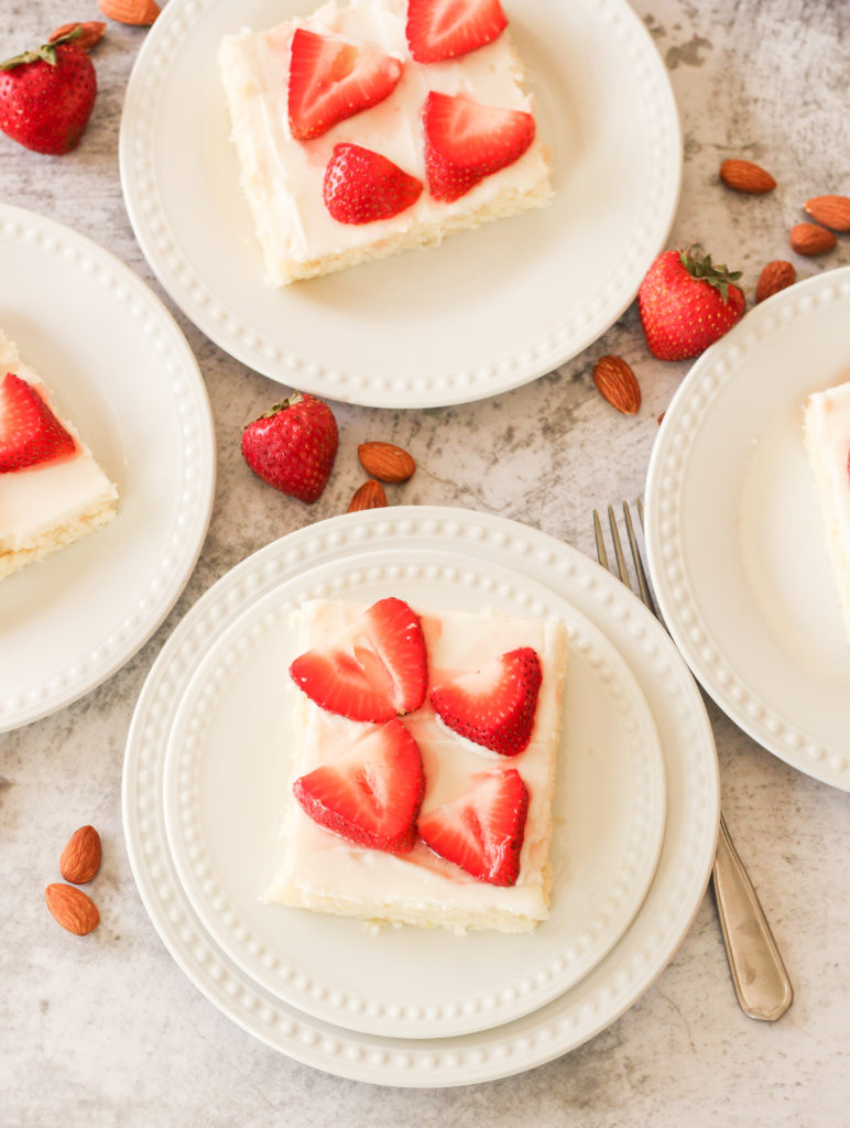 slices of texas sheet cake on white plates