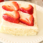 white texas sheet cake topped with strawberries