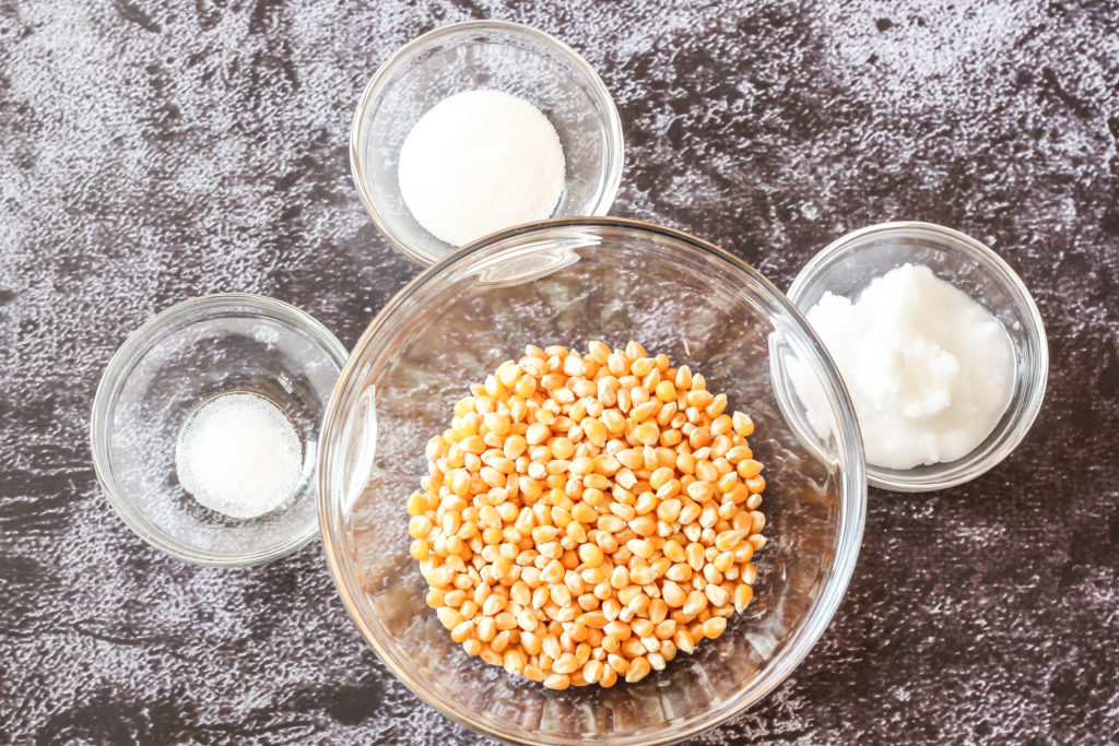 popcorn, coconut oil, sugar and salt in glass bowls