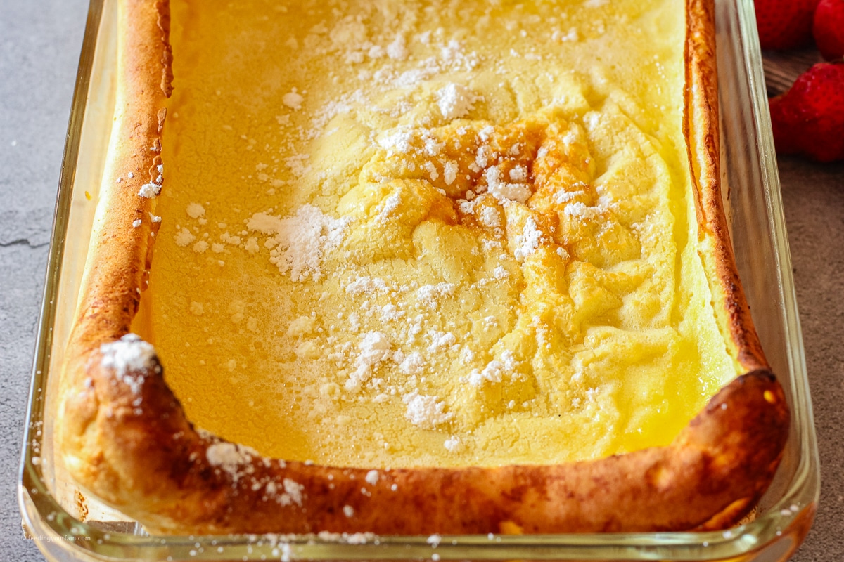 German pancake in a 9 x 13 baking dish with puffy, golden brown sides in a baking dish