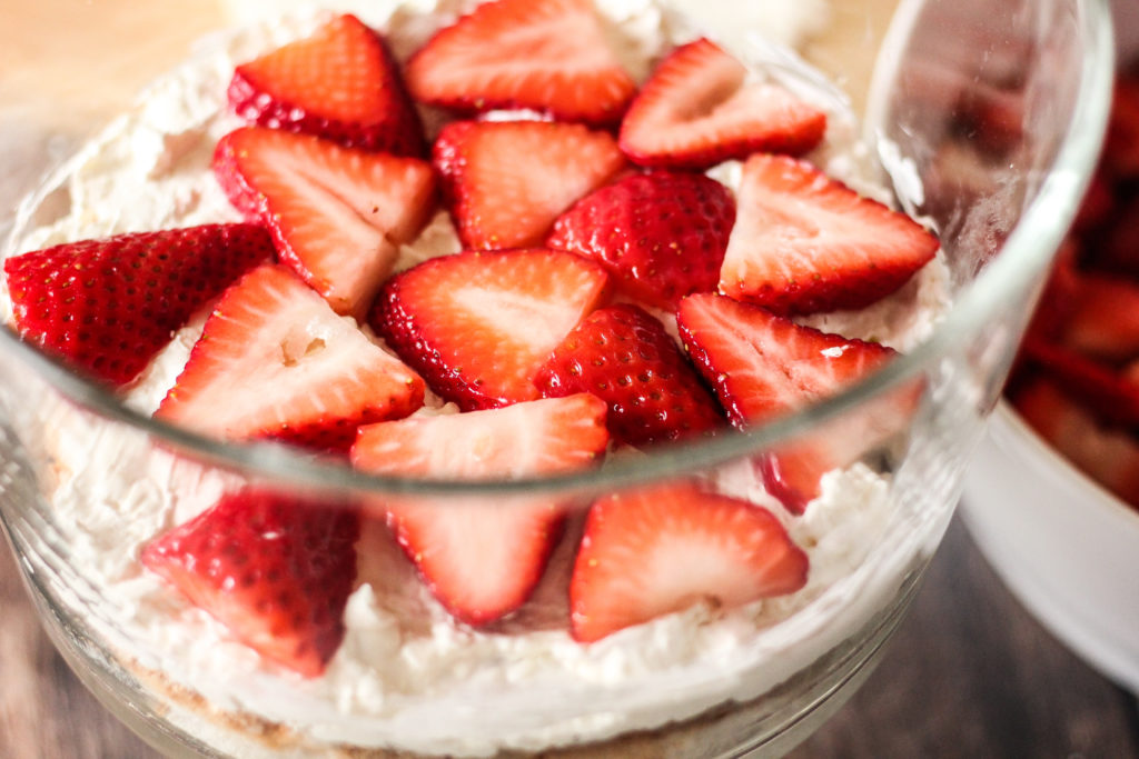 layering strawberries for a trifle