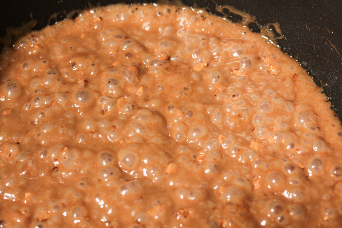 caramel colored bubbling toffee in a pot