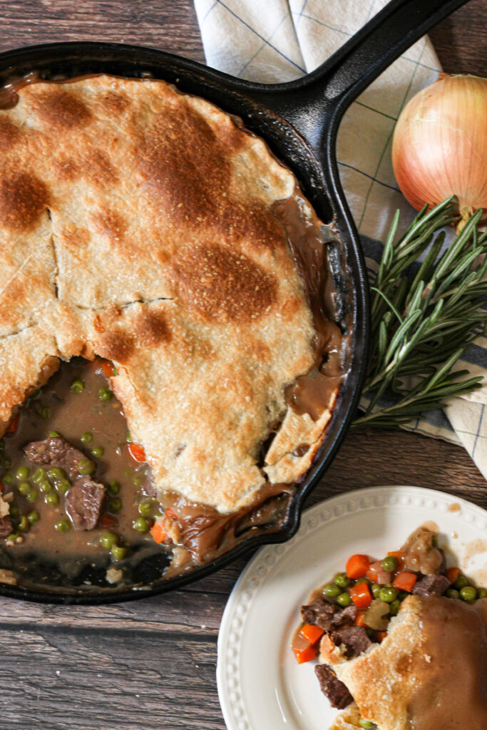 Homemade Beef Pot Pie has bits of steak, vegetables and onions in a creamy beef gravy topped with a flaky pie crust. This Easy Beef Pot Pie Recipe is ready in under 30 minutes, perfect for a busy weeknight meal! beef pot pie