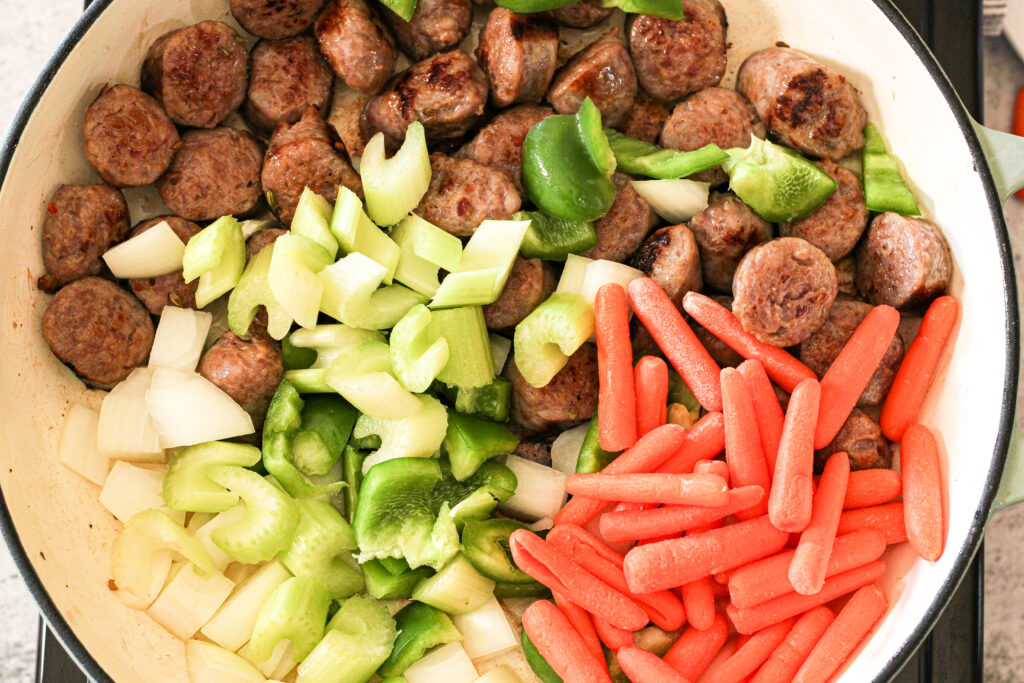 cooking sausage and vegetables
