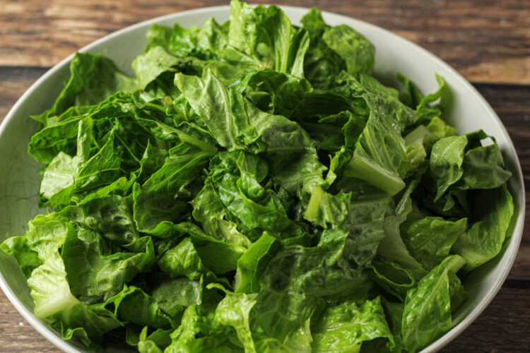 chopped lettuce in a white bowl