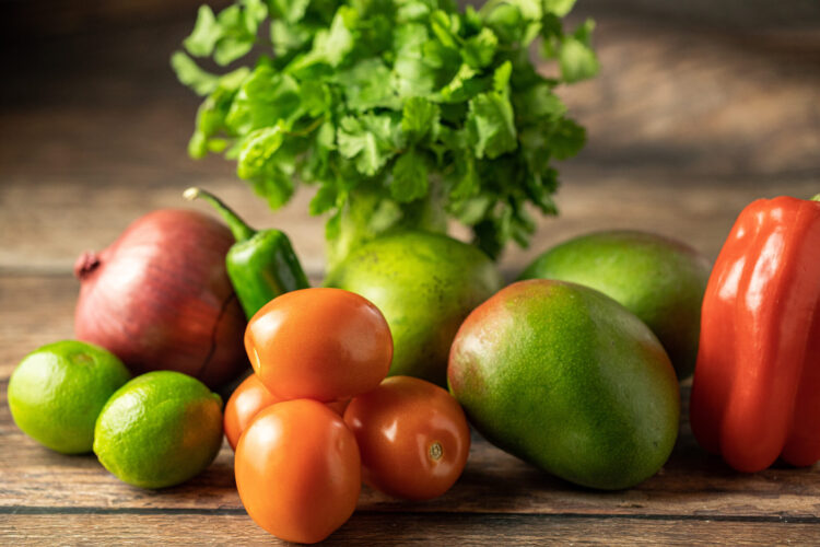tomato, mango, red pepper, red onion, limes and cilantro. Ingredients for mango salsa