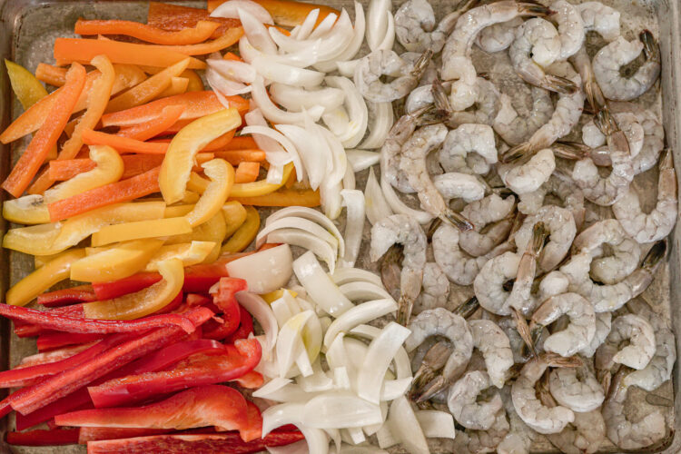 peppers, onion and shrimp on a sheet pan