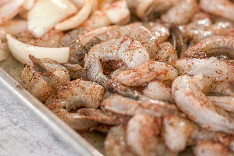 seasoned shrimp on a sheet pan