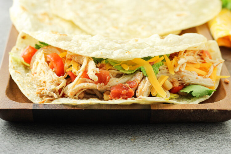 shredded chicken in a tortilla shell