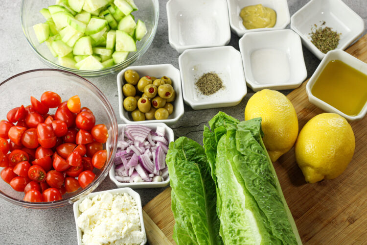 ingredients for greek garden salad in little bowls