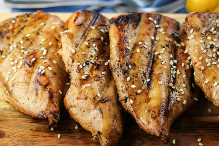 marinaded grilled teriyaki chicken that has been cooked and has sesame seeds on top