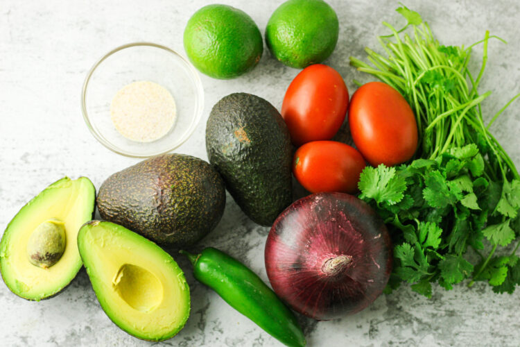 avocados, red onion, cilantro, tomatoes, limes and jalapeno