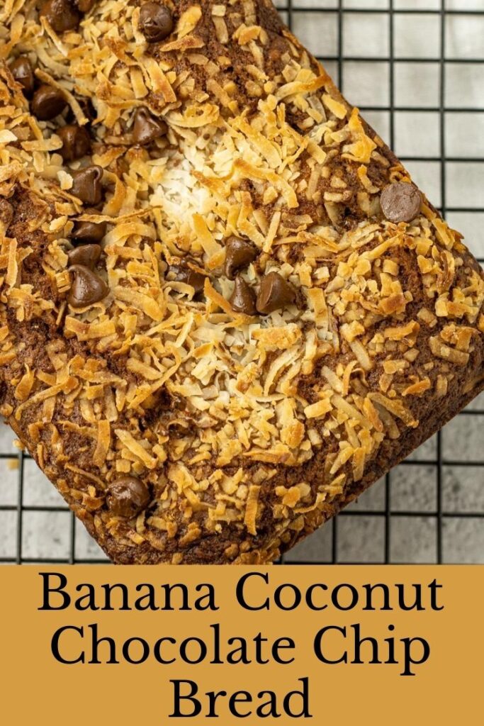 Banana Coconut Chocolate Chip Bread banana bread topped with coconut and chocolate chips on a cooling rack