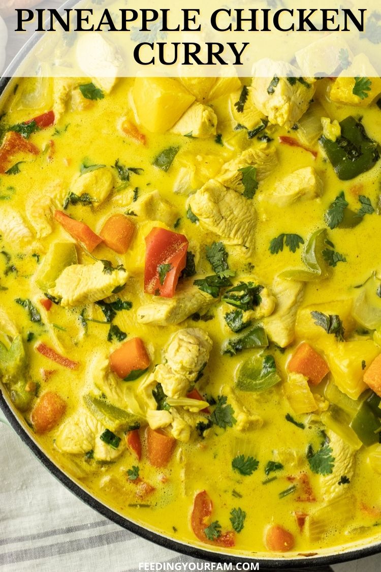 Pineapple Chicken Curry is a simple, 30 minute meal that is loaded with fresh veggies and chicken in a creamy coconut curry sauce. Pineapple Curry is one of those meals you will crave after trying it just once. #curry #chickenrecipe #pineapple #pineapplecurry pineapple chicken curry in a big pan