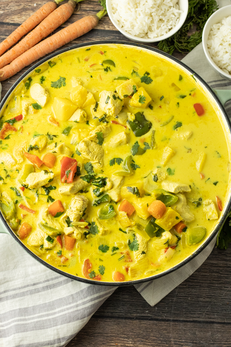 big pot of yellow pineapple curry with chicken