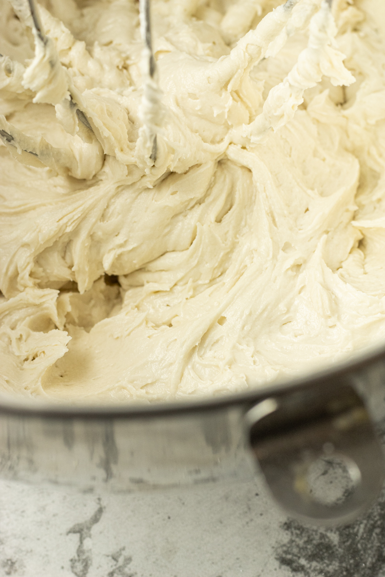 white frosting in a mixing bowl