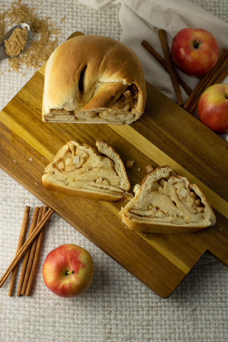 slices on apple bread on a wooden cutting board
