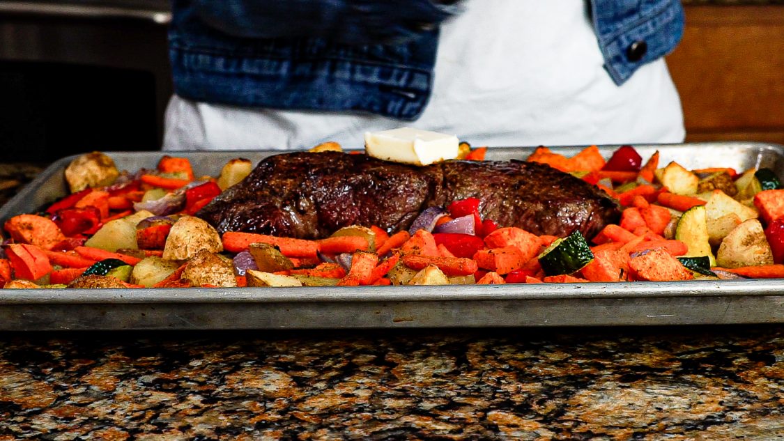 london broil sheet pan meal with butter on top of steak