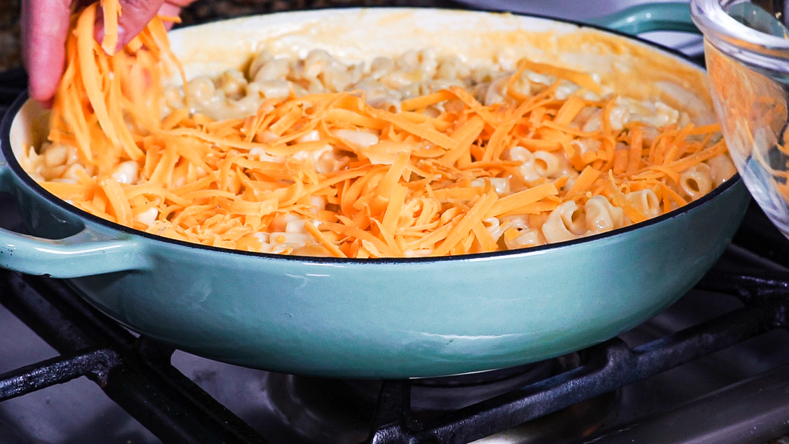 mac and cheese topped with shredded cheese