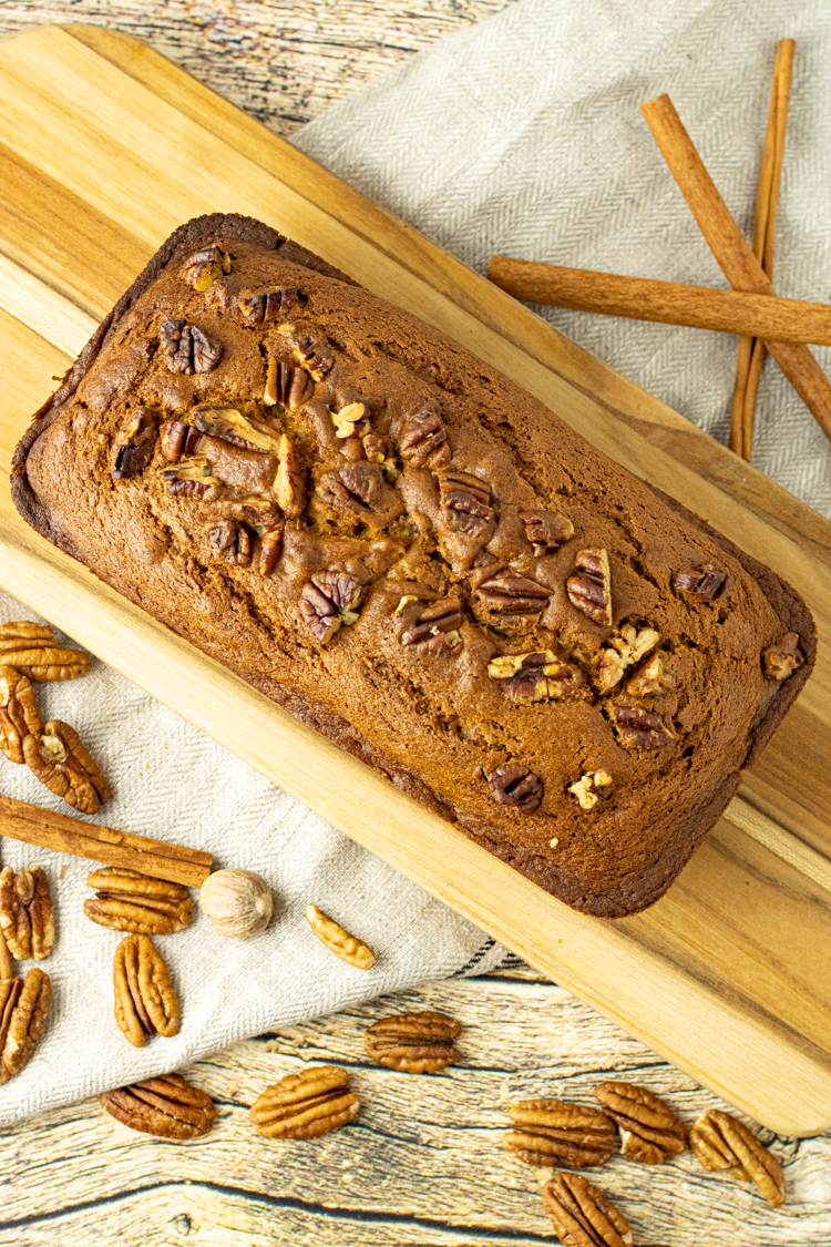 pumpkin bread on a wooden cutting board