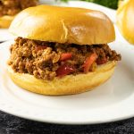 sloppy joe sandwich on a white plate
