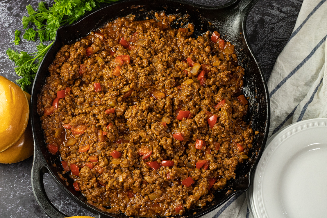 sloppy joe mix in a cast iron skillet