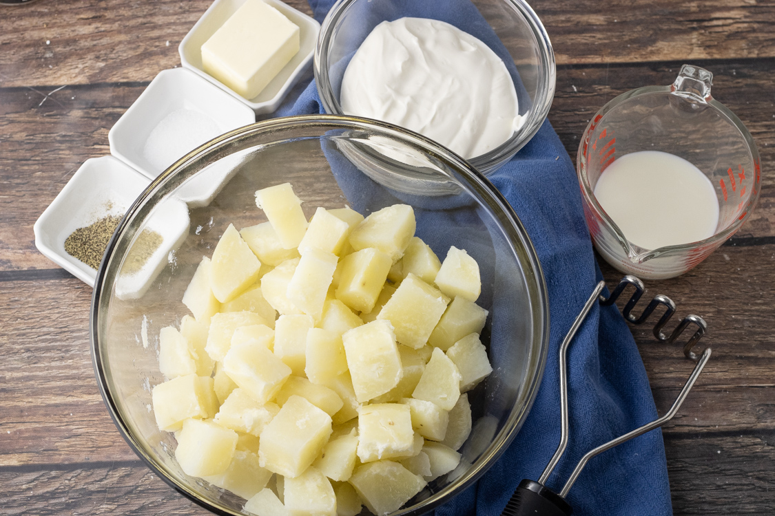 cooked potatoes with sour cream, milk, salt, pepper and butter