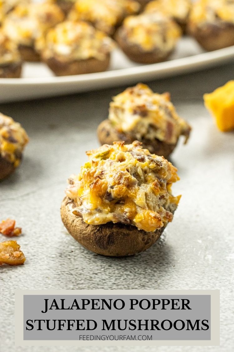 Jalapeno Popper Stuffed Mushrooms are tasty little Baby Bella Mushrooms stuffed with cream cheese, sharp cheddar, jalapenos and bacon. Stuffed Mushrooms are a classic appetizer at any occasion. This Stuffed Mushroom Recipe is simple and always a huge hit at any party I bring these to. 