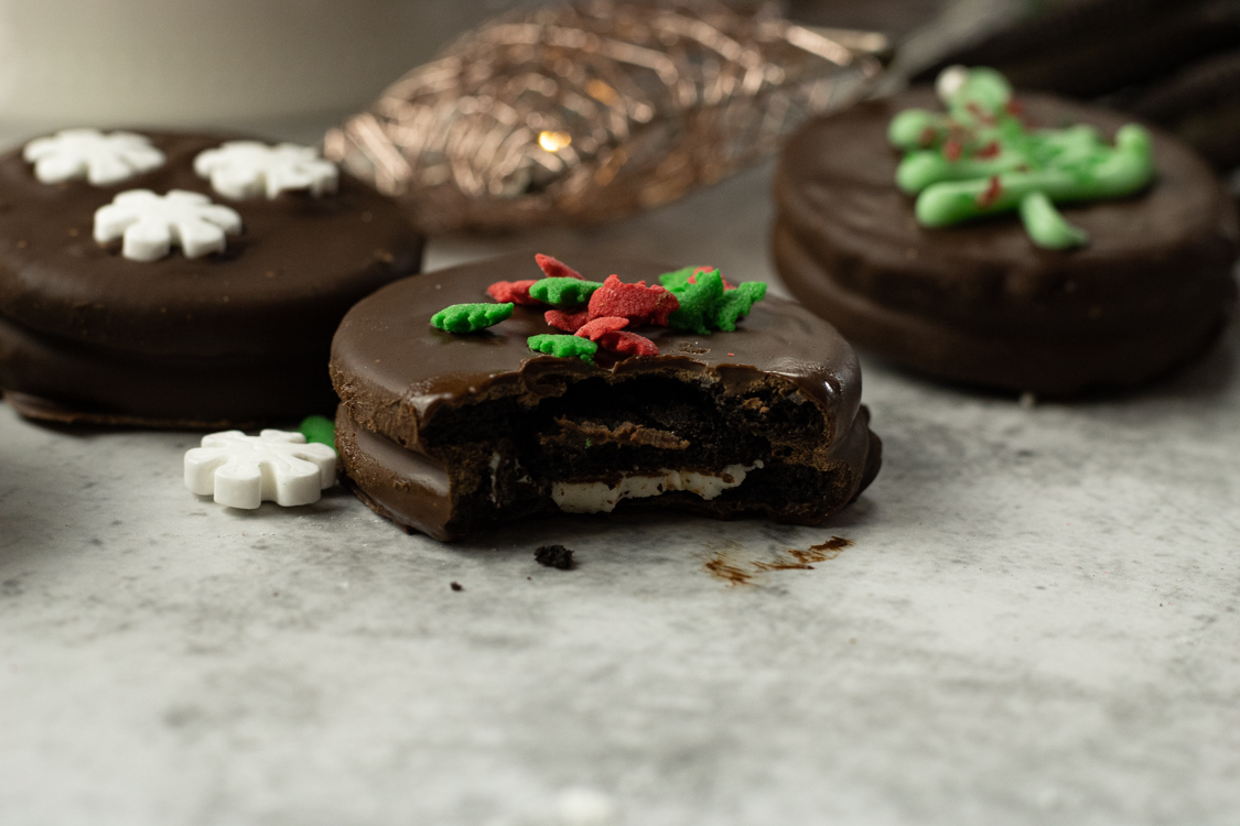 chocolate covered oreo with a bite out of it