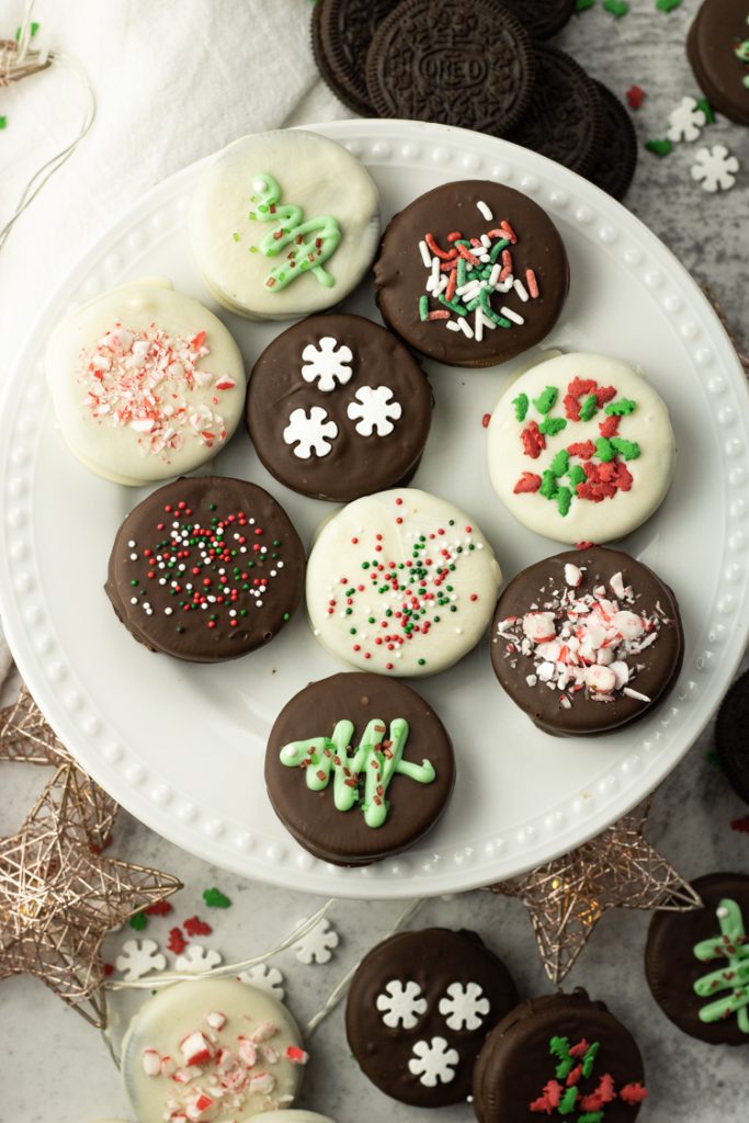 oreos dipped in chocolate on a white plate