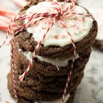 stack of chocolate cookies with white chocolate frosting