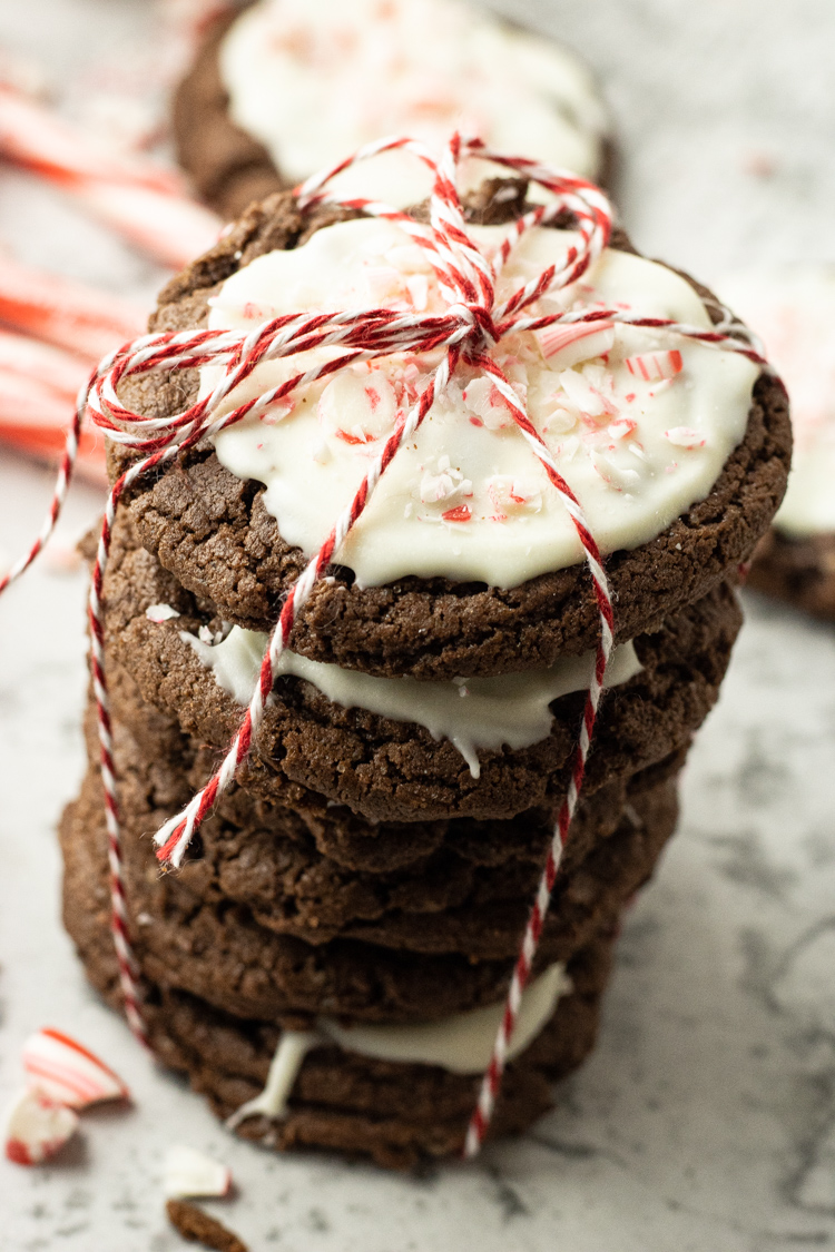 Chocolate Peppermint Cookies are simple cake mix cookies flavored with a touch of peppermint, topped with white chocolate and crushed candy canes. 