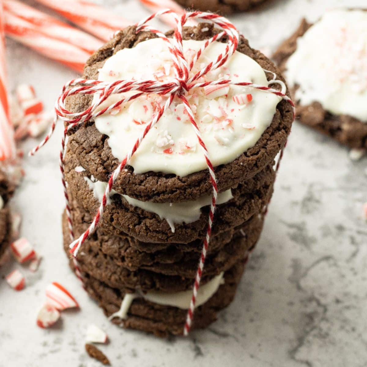 stack of chocolate cookies topped with white chocolate frosting