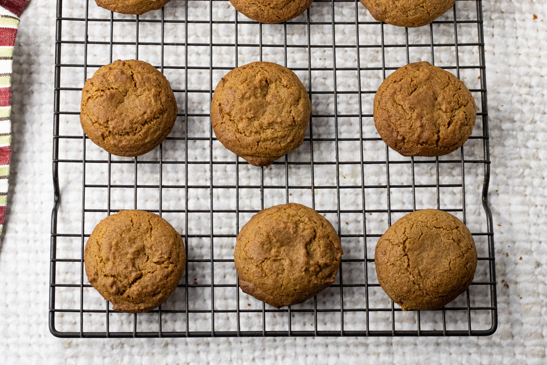 cooked ginger cookies on a cooling rack