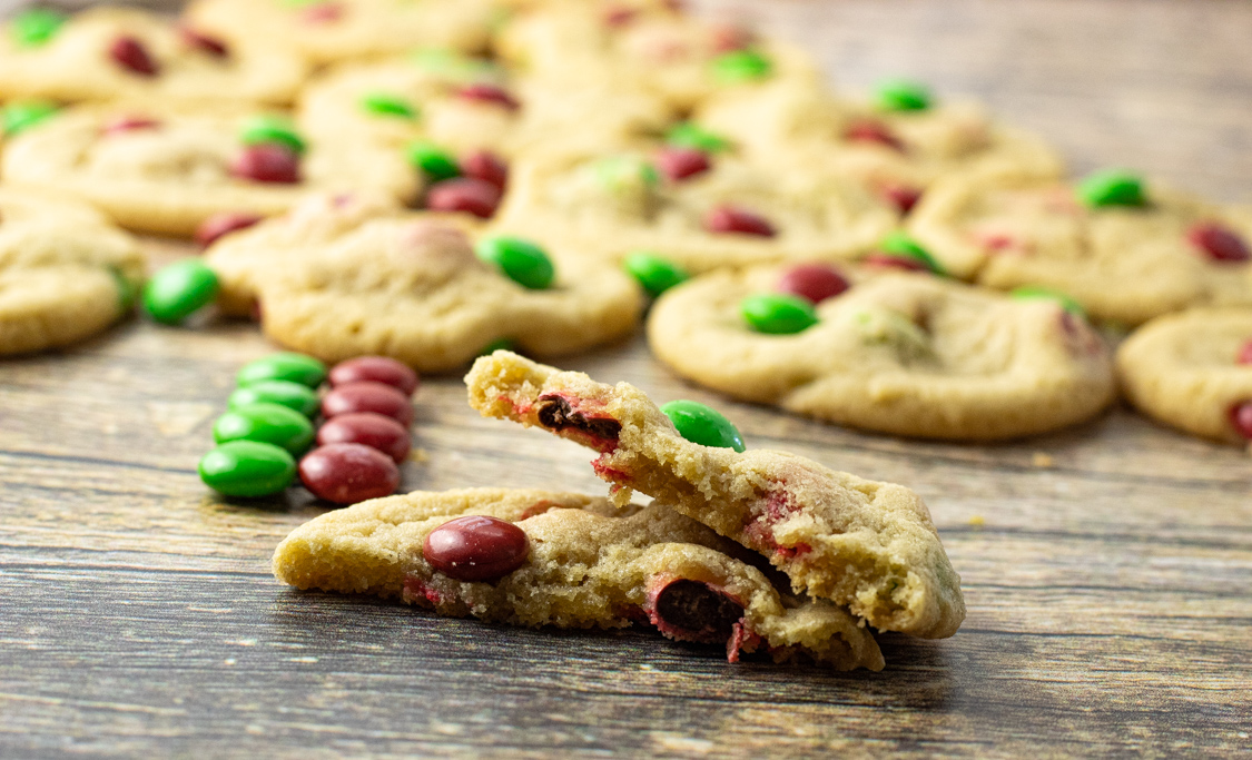 M & M candy cookie broken in half to show center