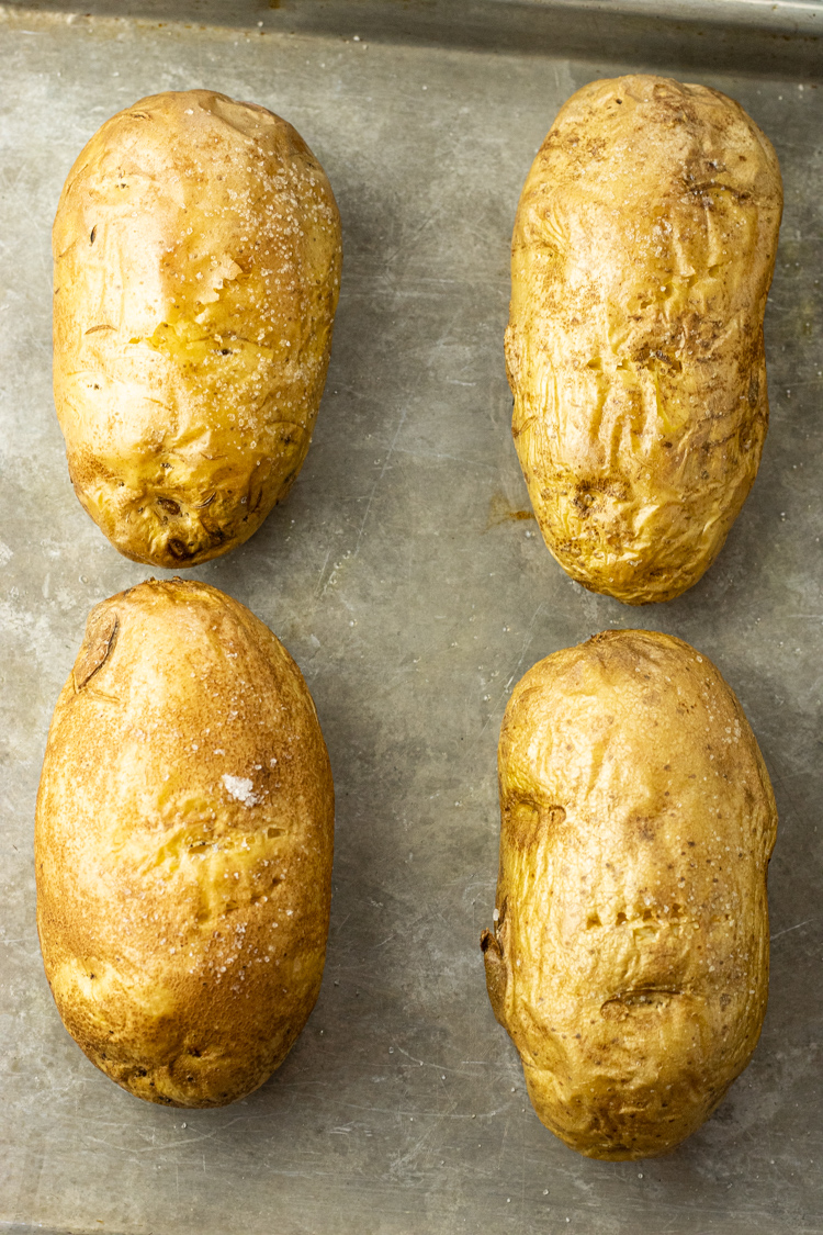 oven baked potatoes on a baking sheet