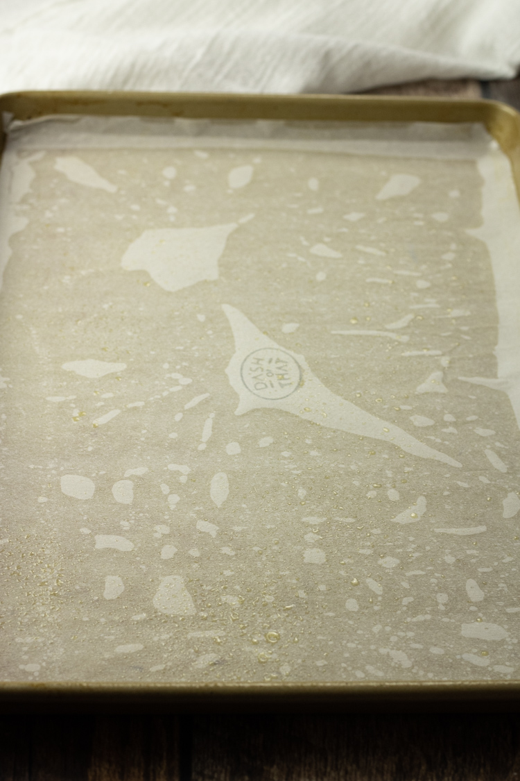 jelly roll pan with a layer of parchment paper