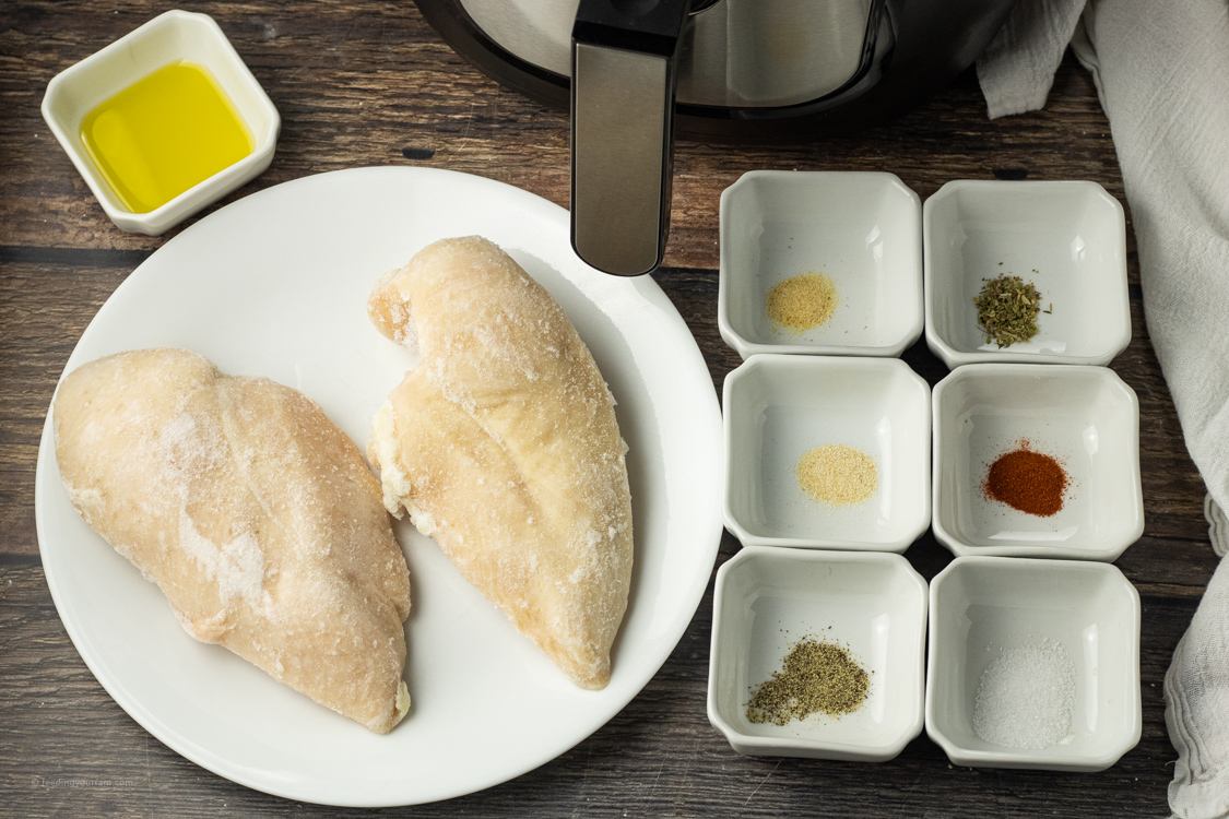 frozen chicken breasts in air fryer with oil and spices