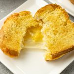 melted cheese sandwich being pulled apart