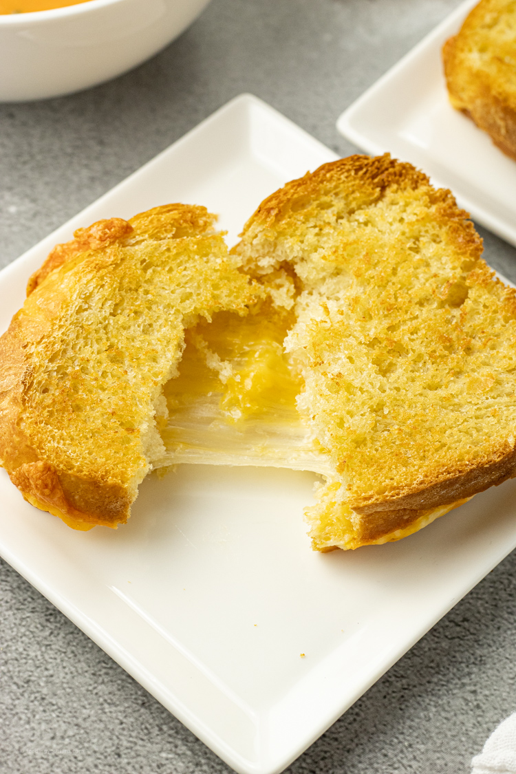 melted cheese sandwich being pulled apart