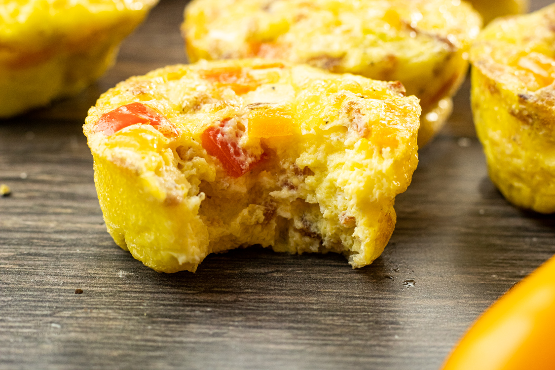 bacon, egg and cheese muffin with a bite out